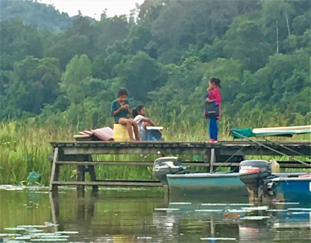 children-from-kampung-cendahan-play-at-the-village-jetty